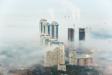 Residential complex Sparrow Hills (Vorobyovy Gory) and construction site of residential complex Dolina Setun in morning fog. © Pavel Losevsky