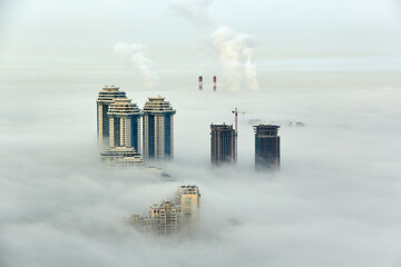 Residential complex Sparrow Hills (Vorobyovy Gory) and construction site of residential complex Dolina Setun in morning fog. © Pavel Losevsky