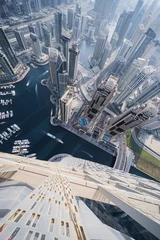 Papier Peint photo autocollant Helix Bridge  Cayan Tower top view in Dubai Marina area, Cayan is tallest building in world, which is twisted by 90 degrees