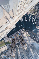  Roofer legs on Cayan Tower in Dubai Marina area, Cayan is tallest building in world, which is...