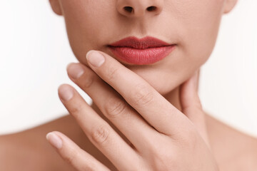 Obraz premium Woman with beautiful lips on white background, closeup