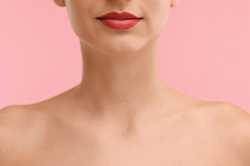 Fototapeta na wymiar Woman with beautiful lips on pink background, closeup