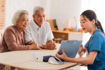Fototapeta premium nursing home assistance in health insurance business concept, asian woman doctor or nurse caregiver support health care to elderly senior patient person, caretaker in medicals care recovery service