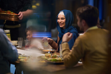 In a heartwarming scene, a professional chef serves an European Muslim family their iftar meal during the holy month of Ramadan, embodying cultural unity and culinary hospitality in a moment of shared