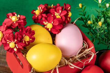 eggs in wooden box with hay on rustic background or surface, easter or holiday concept