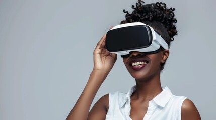 Smiling woman experiencing virtual reality technology. Joyful female wearing VR headset for immersive entertainment. Modern virtual reality gear in use by happy African American woman.