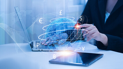 A businesswoman with a laptop computer filled with foreign money. The concepts of interbank...