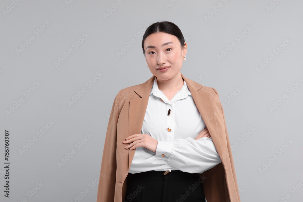 Sticker Portrait of beautiful businesswoman on grey background. Space for text