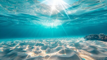 Fototapeta na wymiar Seabed sand with blue tropical ocean above and sunny blue sky