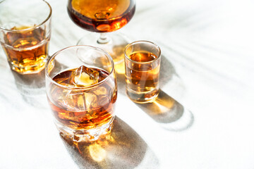 Strong alcohol drink. Cognac, whisky, rum, tequila at white background.