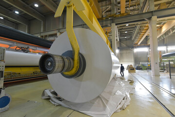 paper mill - production of paper rolls for the printing industry - paper rolls in a factory