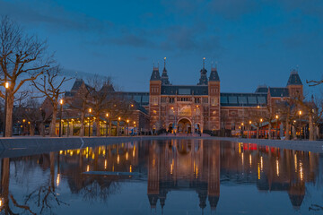Amsterdam, Netherlands March 25 2022: Amsterdam in a cold night during spring season. Famous...