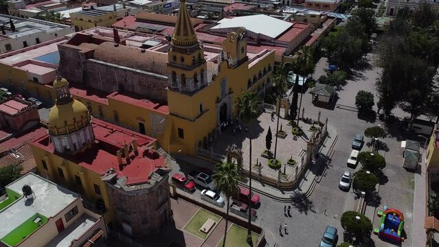 Etzatlán, México. Aereal shot, Drone. Travelling and tilt up over small town near Guadalajara, Jalisco, revealing a tradicitional church