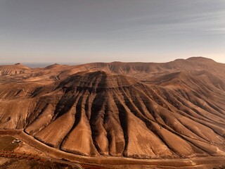 Old Volcano Mountain on Lanzarote - aerial shot, red tones, mars atmosphere	
