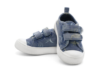 Unbranded fashion stylish walking kid shoes or baby velcro sneakers isolated on white background.