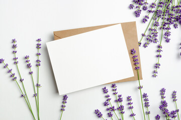 Greeting or invitation card mockup with envelope and fresh lavender flowers