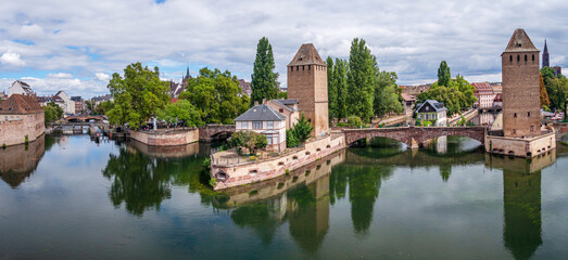 Panoramic view on The Ponts Couverts in Strasbourg with blue cloudy sky. France.