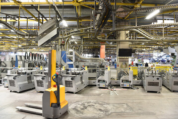 modern machines for transportation in a large print shop for production of newspapers & magazines