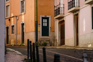 Fototapeta na wymiar Empty cobblestone street with tram tracks in Lisbon, Portugal