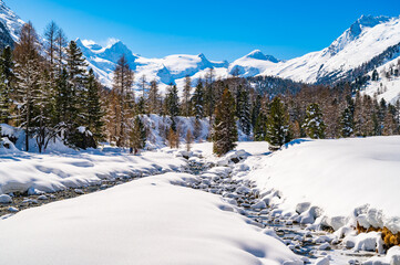 Val Roseg, in Engadine, Switzerland, in winter, with snow-covered cross-country ski slopes.
