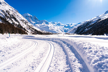 Val Roseg, in Engadine, Switzerland, in winter, with snow-covered cross-country ski slopes.
