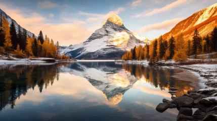 Foto op Canvas The reflection of a mountain in a golden lake © Cloudyew