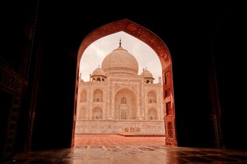 Fototapeta na wymiar Taj Mahal ivory-white marble mausoleum Best Example of Mughal architecture in 17th Century with a blend of Indian, Persian, and Islamic styles