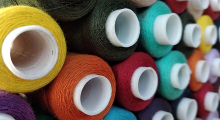 colorful spools of thread for embroidery close up background