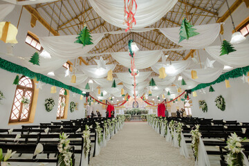 Interior of the church with decoration for wedding with candles light
