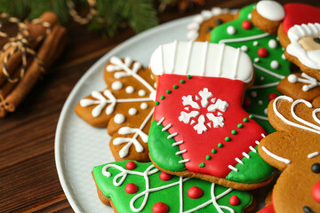 Different tasty Christmas cookies on wooden table, closeup. Space for text