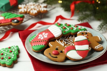 Fototapeta na wymiar Tasty homemade Christmas cookies on white wooden table, closeup