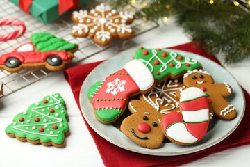 Fototapeta na wymiar Tasty homemade Christmas cookies on white wooden table