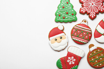 Different tasty Christmas cookies on white background, flat lay. Space for text
