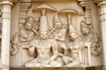 Hindu God and Animal sandstone sculptures in ancient hindu temple walls. Historical statues of...
