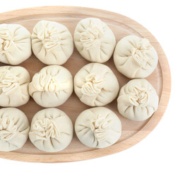 Board with uncooked khinkali (dumplings) isolated on white, top view. Georgian cuisine