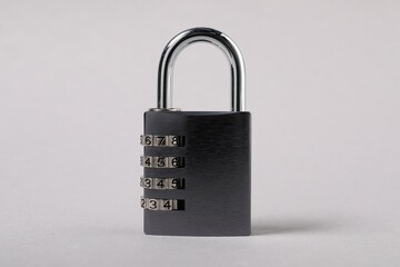 One steel combination padlock on grey background, closeup