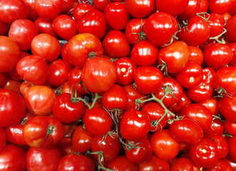 buying vegetables ( peppers,  tomatoes) at the market