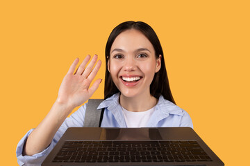 Online class greeting, female student with laptop waving hello