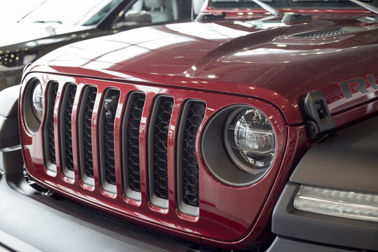 Russia, Izhevsk - March 4, 2022: Jeep showroom. Bumper of a new off-road. Wrangler Unlimited. Elegant round headlamps. Off-road vehicles. Alliance Stellantis. Cropped image. Modern transportation.