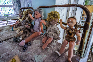 Dolls on a bunk bed in Cheburashka kindergarten in Pripyat abandoned city in Chernobyl Exclusion...