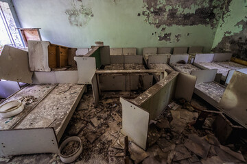 Beds in Cheburashka kindergarten in Pripyat abandoned city in Chernobyl Exclusion Zone, Ukraine