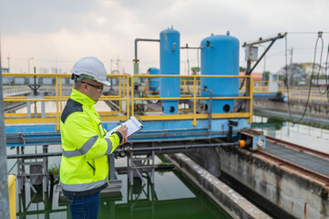 Environmental engineers work at wastewater treatment plants,Water supply engineering working at Water recycling plant for reuse