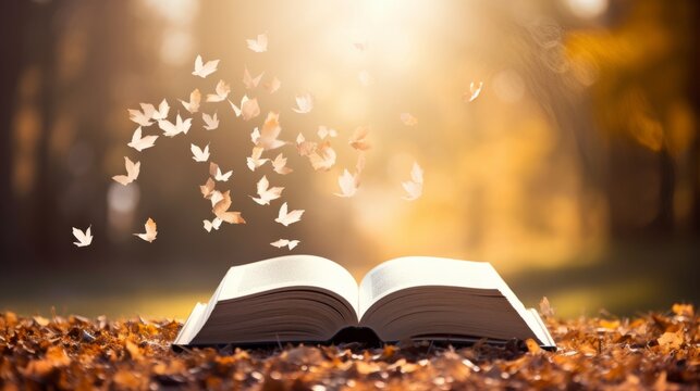 An open book with pages fluttering in the breeze
