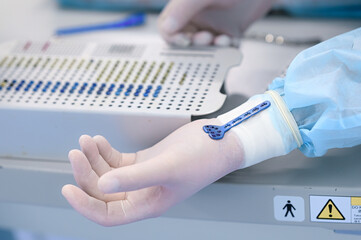 Doctor chooses orthopedic bolts and screws for surgery