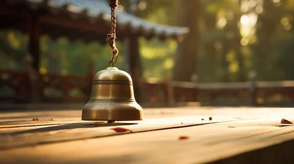 Foto op Canvas A zen bell being rung to mark the beginning of meditation © Cloudyew