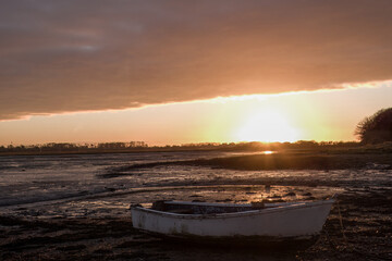 row boat on the beach at sunset Emsworth Hampshire England	