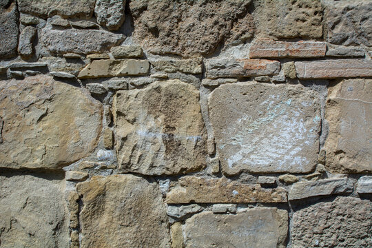 Close-up of a brown stone wall. Background image with copy space