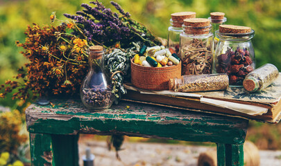 Dried medicinal herbs on the table. Selective focus.