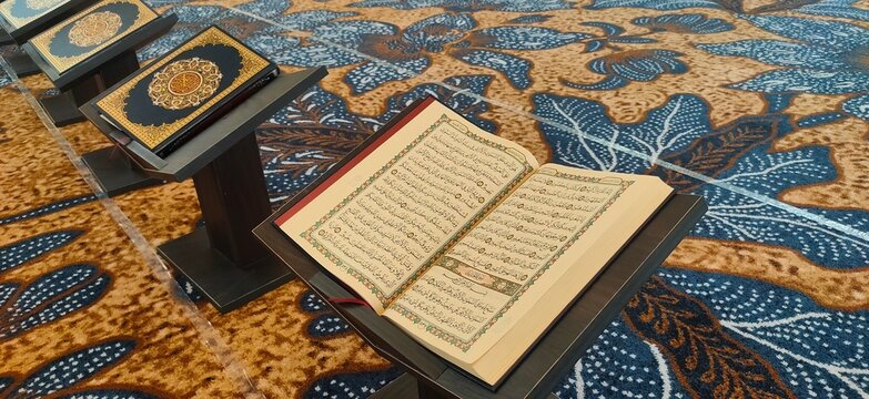 Opened al quran book on mosque floor