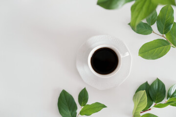 White and green desk background with coffee, minimalist aesthetic, with copy space
